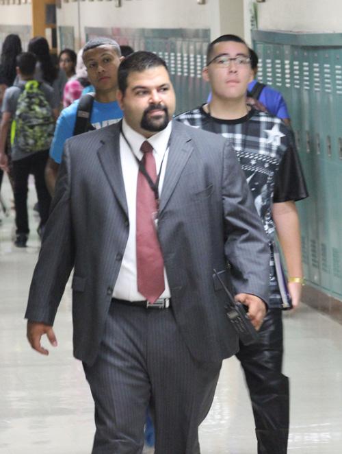 Shahveer Dhalla walks the halls on the morning of his first day as principal of AHS. Dhalla welcomed students and teachers back to school.