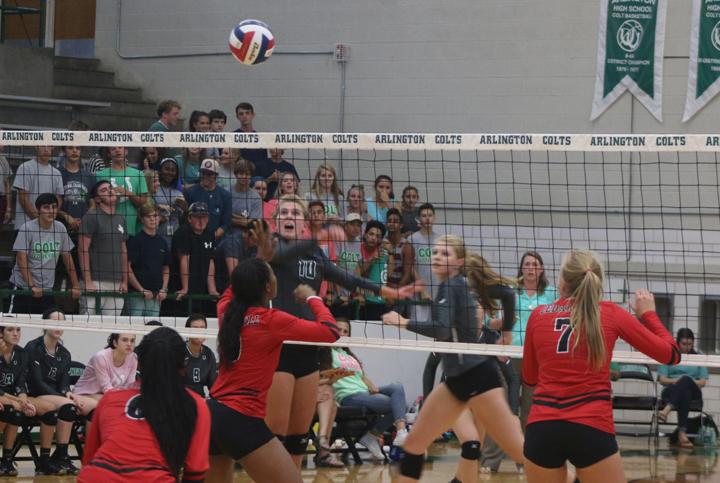 Senior Brooke Fearka hits the ball over the net and over the heads of the Cedar Hill Longhorns.