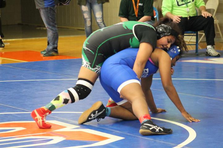 Junior+Naara+Gonzalez+gets+in+position+to+pin+her+opponent.+Gonzalez+was+one+off+two+Lady+Colt+wrestlers+to+place+at+state+this+year.