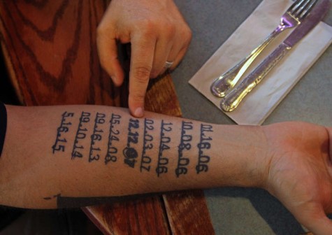 Fetterman’s left arm is adorned with the dates of every death that has occurred in Braddock as a result of gun violence since he took office in 2005. There are a total of nine dates on his arm.