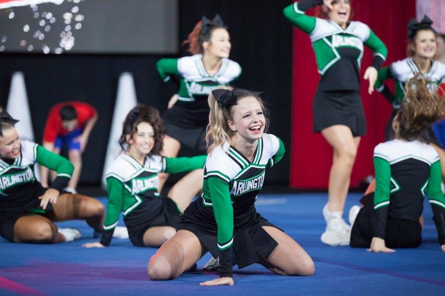 Senior Madison Moore flashes a beaming smile during the dance portion of the routine. 