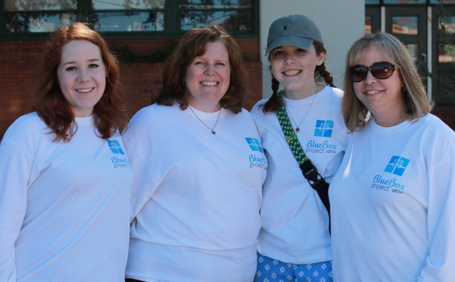 Hannah Flenniken, Julianne Read, Jenna White and Tanya Maness stand together at the Blue Box drive. The drive was organized by Flenniken and White in memory of 2016 graduate, Rebecca Read, who passed away in July.