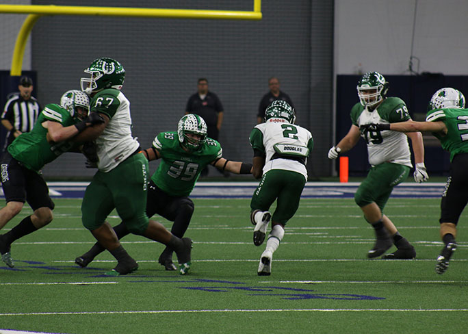Senior RB Kenland McCray makes a break for it past a Southlake Carroll Dragon. The Colts lost 28-24 in the third round of playoffs.