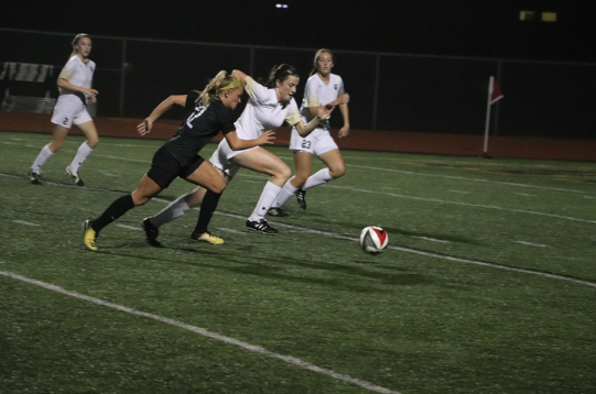 Junior Kayley Dahlin aggressively rushes to win control of the ball. The Lady Colts finished the year with a 13-1 record in district play but fell to Keller High School in the first round of playoffs.