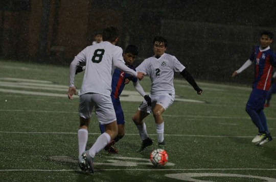 Junior Kent Lawrence and senior Andrew Stretch battle a Sam Houston player for control of the ball. The Colts beat the Texans both times they faced off this season.