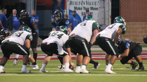 The offensive line lines up against Byron Nelson. The Colts beat the Bobcats 37-34.