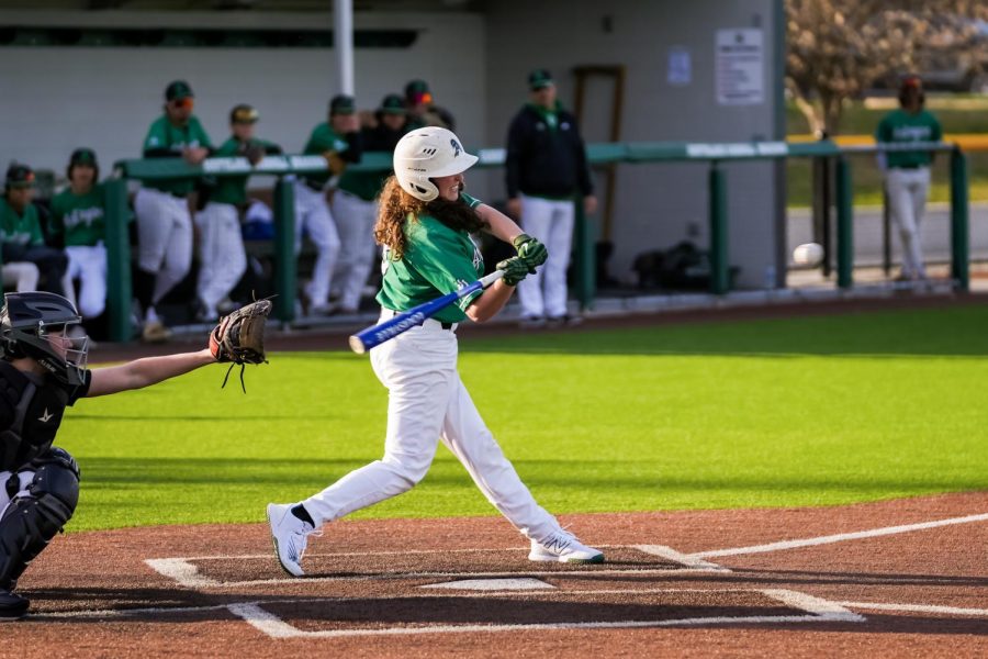 Abby Moore gets a hit during the game. When asked why baseball? her answer is simple - I love the sport.